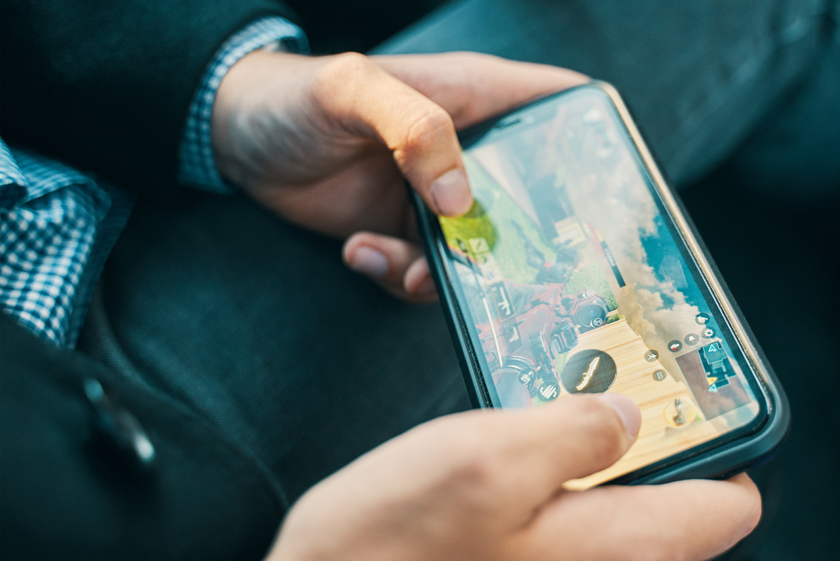 Hand Playing Video Game on Smartphone